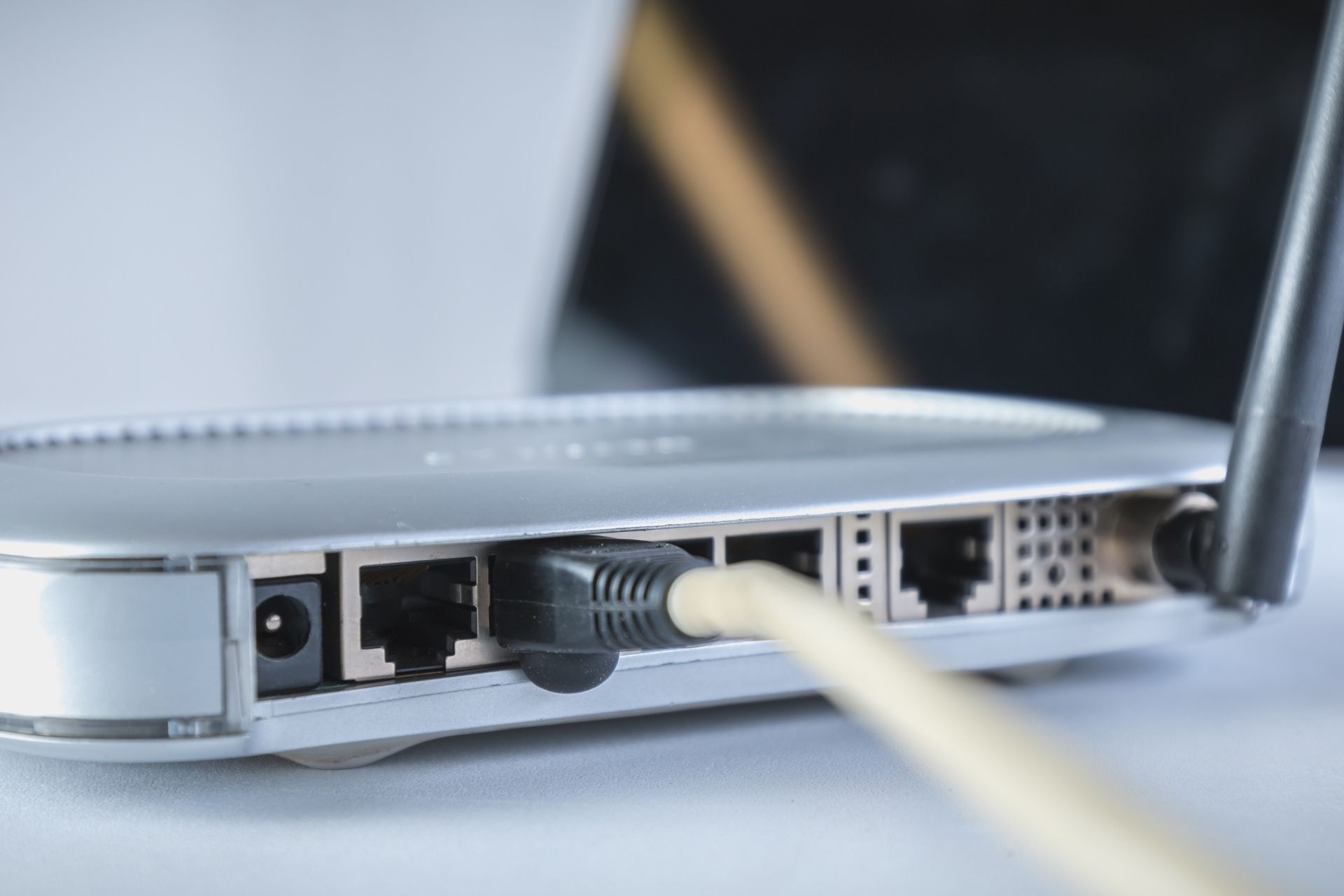 How does signal degradation occur in a hybrid fiber-coaxial network, and what measures are taken to mitigate this issue?