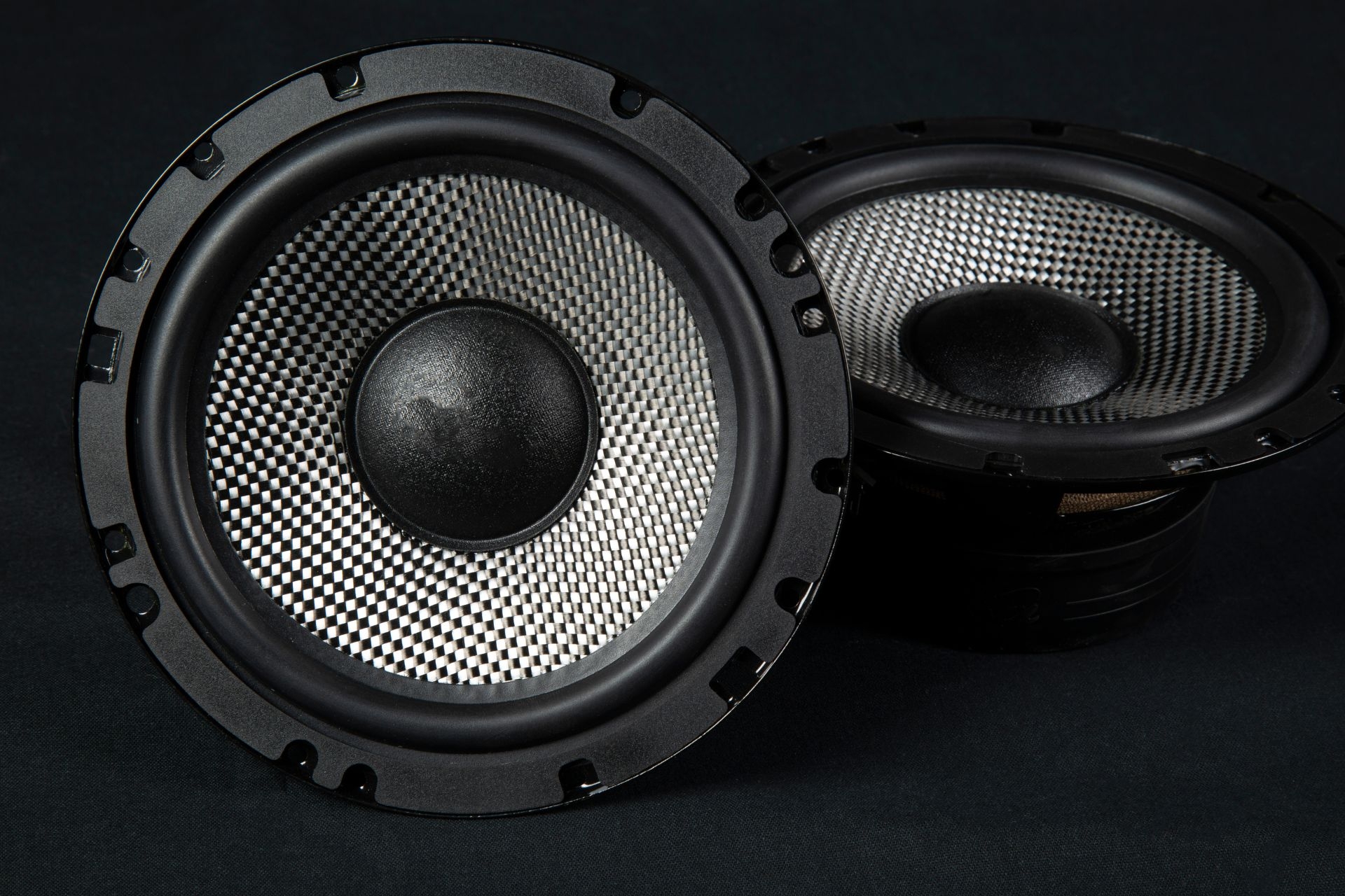 What are some common challenges faced when using ground stack speaker setups, and how can they be overcome?